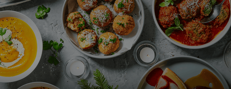 Providoor chef-made dishes on a table - croquettes, meatballs in tomato sauce and soup