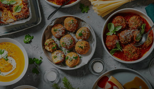 Providoor chef-made dishes on a table - croquettes, meatballs in tomato sauce and soup